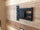 Wooden TV stand wall RUSTIC style frame and covering in solid recycled wood multicolored effect 290x35xh280cm MADE TO MEASURE