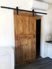 Porta scorrevole per interni stile INDUSTRIAL legno massello scorrimenti con carrucole su rotaia in ferro 95xh220 cm personalizzabile