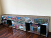 Credenza Madia modello Marilena stile industrial shabby multicolore in legno con 2 ante scorrevoli e 12 cassetti – 300×40×80 cm